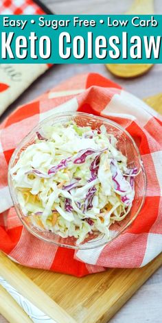 a bowl filled with coleslaw on top of a cutting board