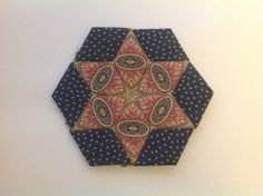 an ornament made out of fabric on a wall