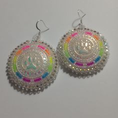 Hand-made beaded earrings: Colors: Clear white w/florescent rainbow middle: bear claw Closure: Hook size: 2 inches Beadwork Ideas, Handmade Beaded Earrings, Bear Claw, Beaded Earring, Bear Claws, Handmade Earrings Beaded, Earring Ideas