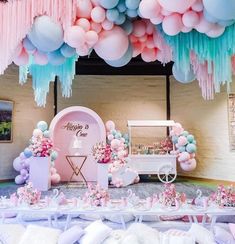 a room filled with lots of balloons and decorations