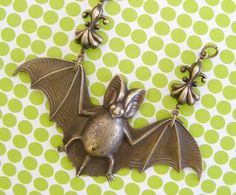 Bat Handmade Antique Jewelry Gift, Unique Hand Cast Dangle Jewelry, Whimsical Adjustable Brass Jewelry, Whimsical Metal Pendant Jewelry, Whimsical Wire Wrapped Jewelry For Crafting, Whimsical Handmade Gold Jewelry, Handmade Bronze Necklaces For Wedding, Vintage Bronze Jewelry For Crafting, Unique Decorative Dangle Jewelry