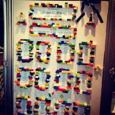 a bulletin board made out of legos on the side of a wall with ribbon