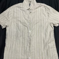 Hollister Striped Linen Shirt Size Medium. Never Worn, No Tags. Very Nice Shirt To Wear Casual Or Dressy! Classic Striped Linen Tops, Casual Striped Linen Tops, Striped Linen Short Sleeve Top, Casual Linen Top With Collar, Casual Beige Button-up Short Sleeve Shirt, Casual Beige Top With Spread Collar, Striped Top With Button Closure And Spread Collar, Striped Top With Spread Collar And Button Closure, Casual Striped Button-up Short Sleeve Shirt