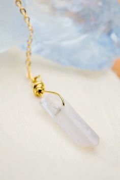 The Long White Crystal Necklace features beautiful quartz crystal wrapped in gold wire and suspended from a gold plated chain. Each purchase supports at-risk women in the United States. Product Suggestion: Long Pink Crystal Necklace White Crystal Necklace, Pink Crystal Necklace, Blue Crystal Bracelet, Trend Jewelry, Raw Quartz Crystal, Raw Quartz, Pearl Brooch, White Crystal, Gold Wire