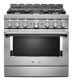 a stainless steel stove with four burners and two oven doors on the front side