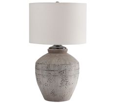 a gray table lamp with a white shade