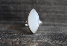 natural white moonstone ring stone size-24*10mm *ship worldwide from india SHIPPING POLICY >After receipts of payment,ship within 1-3 days. >Delivery will take 2-4 weeks >any question please contact us. THANKS YOU VERY MUCH FOR VISITING US. White Moonstone Oval Cabochon Ring In Sterling Silver, White Oval Cabochon Moonstone Ring With Gemstone, White Moonstone Ring With Oval Cabochon, Minimalist Handmade White Moonstone Ring, White Moonstone Opal Ring In Oval Cabochon Shape, White Opal Ring With Oval Cabochon Shape, White Oval Moonstone Ring In Minimalist Style, White Oval Moonstone Ring, White Oval Chalcedony Rings