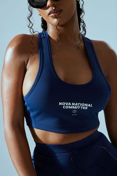 Available In Navy. Sports Bra Cropped Racer Back Stretch 78% Polyester 22% Spandex Imported | FN Paris Racerback Sports Bra in Navy Blue size XS by Fashion Nova High Stretch T-back Tops For Sports, Blue High Stretch Racerback Sports Bra, High Stretch Blue Racerback Sports Bra, Blue Racerback Sports Bra For Light Sports, Blue Medium Support Tank Top For Gym, Blue Compressive Racerback Activewear, Functional Blue Racerback Tank Top, Supportive Blue Gym Tank Top, Sporty Fitted T-back Sports Bra