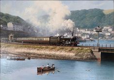 a train traveling down tracks next to a body of water with boats on the side