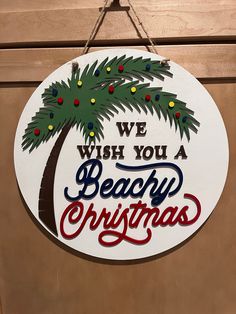 a sign that says we wish you a beachy christmas