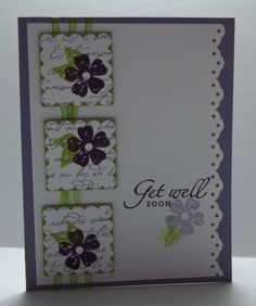 a card with three flowers on it and the words get well soon written in green