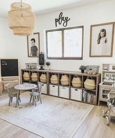 a child's playroom with toys, bookshelves and baskets on the floor