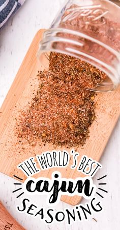 the world's best cajun seasoning is in a jar on a cutting board