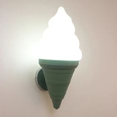 an ice cream cone light on the wall