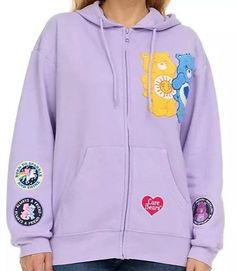 This zippered Hoodie Jacket is not just cute but also super soft on the inside. Machine Wash Cold Tumble Dry Low 60% Cotton 40% Polyester Includes: Chenille With Embroidered Multi Patches Cute Fleece Outerwear With Drawstring Hood, Trendy Fleece Hooded Jacket, Cute Outerwear With Drawstring Hood For Streetwear, Cute Streetwear Outerwear With Drawstring Hood, Trendy Hooded Hoodie With Zipper Closure, Cute Hoodie For Streetwear, Cute Hoodie Outerwear For Streetwear, Cute Purple Cotton Hoodie, Adult Bibs