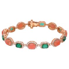 Indulge in the exquisite allure of luxury with this captivating Coral & Zambian Emerald Gemstone Bracelet, a masterpiece of elegance and sophistication. Crafted with meticulous attention to detail, this bracelet is a testament to the unparalleled craftsmanship and artistry of fine jewelry. Item Code :- SEBR-44115C Gross Wt. :- 17.95 gm 18k Yellow Gold Wt. :- 15.13 gm Natural Diamond Wt. :- 2.78 Ct. ( AVERAGE DIAMOND CLARITY SI1-SI2 & COLOUR H-I ) Emerald & Coral Wt. :- 11.30 Ct. Bracelet Length Bracelet Diamond, Zambian Emerald, Yellow Gold Jewelry, Coral Beads, Emerald Gemstone, Zambia, Top Seller, Diamond Bracelets, Shades Of Red