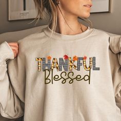 This cozy sweatshirt features a beautifully designed "Thankful Blessed" logo, perfect for embracing gratitude and positivity in style. Ideal for casual wear, it's a warm and uplifting addition to your wardrobe.    ABOUT OUR Thanksgiving Sweatshirt.  ▸ These garments are made from polyester and cotton.  ▸ The collar is ribbed knit, so it retains its shape even after washing.  ▸ There are no itchy side seams on these sweaters.  ▸Printed and shipped from the USA  ▸ Shipped in a safe package to ensu Thanksgiving Sweater, Thanksgiving Sweatshirt, Thankful And Blessed, Sweatshirt For Women, Sweater Gift, Cozy Sweatshirts, San Jose, Gratitude, Crewneck Sweatshirt