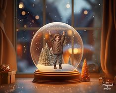 there is a snow globe with a child inside it and christmas trees in the background