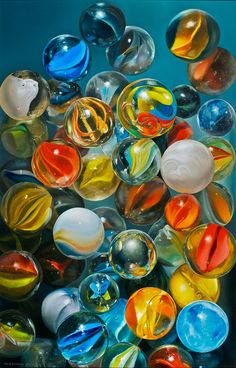 many different colored glass marbles are shown in this image, and there is no image here to provide a caption for