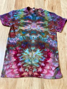 Lotus Tie Dye Shirt | Psychedelic T Shirt | Small Shirt | Galaxy Ice Dye Shirt | Festival Shirt | Mandala Psytrance Shirt | Geode Tie Dye https://fullspectrumdyes.etsy.com Handmade mandala lotus flower tie dye shirt containing vibrant colors with intricate patterns and immense depth Multicolor Pre-shrunk Graphic Tee, Bohemian Multicolor Print Short Sleeve T-shirt, Multicolor Short Sleeve T-shirt For Festivals, Multicolor Bohemian Relaxed Fit T-shirt, Short Sleeve T-shirt With Sublimation Print For Festival, Bohemian Red Cotton T-shirt, Relaxed Fit Crew Neck T-shirt For Festivals, Relaxed Fit Multicolor Pre-shrunk Shirt, Multicolor Rainbow Print Short Sleeve T-shirt