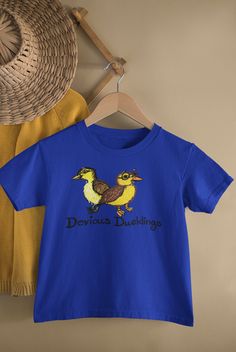 Devious Ducklings - Unisex Short Sleeve Toddler Shirt All Designs Are Homemade And Original Crazy Duck | Gift For Duck Lover | Duck Owner Shirt | Plus Size Duck This is the perfect gift for the crazy duck lovers who is the ultimate animal lover. This duck owner shirt makes a great conversation starter with your family and friends. This gift for duck lovers comes available for the plus-size duck lover in your life. This updated unisex essential fits like a well-loved favorite super-soft cotton, and excellent quality print makes one fall in love with it over and over again. Our shirts are true to size. Our ink is infused into the fibers to give you long wear. .: 100% Airlume combed and ringspun cotton (fiber content may vary for different colors) .: Light fabric (4.2 oz/yd² (142 g/m .: Retai Crazy Duck, Duck Gifts, Great Conversation Starters, Better Love, Unisex Shorts, Cotton Fiber, Clothing Items, Light Fabric, Animal Lover