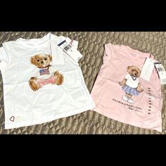 Rl Popular Teddy Bear T Shirts Size 6m Ralph Lauren White T-shirt With Graphic Print, Family Matching Short Sleeve Tops For Playwear, Pink Ralph Lauren Cotton Tops, Ralph Lauren Summer T-shirt With Short Sleeves, Cute Ralph Lauren Summer Tops, White Ralph Lauren T-shirt With Graphic Print, Cute Summer Tops By Ralph Lauren, Ralph Lauren White Tops With Graphic Print, Ralph Lauren White Top With Graphic Print