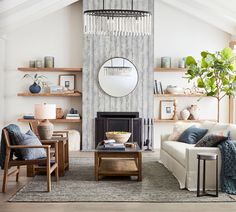 a living room filled with furniture and a fire place