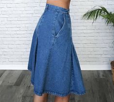 "✿ Adorable late 80s denim pleated skirt. Above knee length with an ultra high waist, dual front side pockets and button up side closures. Two large inverted pleats down front and back that lightly puff and add so much cuteness to this skirt! Medium wash blue denim. Belt loop holes so you can add your favourite belt. We love how a striped vintage turtleneck looks tucked into it. Excellent vintage condition. Cutest find! ✿ Labelled size: Vintage 8 Fits like: Modern day US 4 / Ladies Small / Waist High Waist Pleated Denim Blue Denim Skirt, High Waist Pleated Denim Blue Skirt, High Waist Pleated Denim Skirt In Blue, High Waist Medium Wash Pleated Skirt, High Waist Pleated Skirt In Medium Wash, High Waist Pleated Denim Skirt, Tan Wool Coat, Vintage Turtleneck, Denim Pleated Skirt