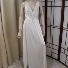 Ivory long nylon nightgown Olga Style by Sears 'Famous Bodies' line Tag size 12/14 Will fit M/L Good condition with light wear No damage noted Measurements below! Stretchy, so larger measurement is stretched measurement! Hand washed and ready to wear Mannequin is 5'10" and 34-24-35 Underarm to underarm: 16-21" Bust: 35-38"  Waist: 26-34" Hips: Up to 44" Length from underarm to hem: 52" Length from top of shoulder to hem: 60.5" We offer a fair return policy. Check out our policies for details Cream Sleeveless Nightgown, Beautiful Nightgown, Women's Nightgowns, Pajama Robe, Nightgowns, Night Gown, Favorite Outfit, Ready To Wear, Size 12