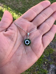 Green Evil eye necklace * New sterling Silver Necklace * Protection necklace * Green Turkish evil eye * Amulet necklace * Evil eye jewelry What does green evil eyes mean? The dark green evil eye promotes happiness, balance, and freedom. Nothing says good vibes like a dark green evil eye. If you've been looking for a boost of joy in your life and a bit more balance, this is the color for you. With a green evil eye at your side, you'll feel free to pursue the things that make you happy.🧿. Green Sterling Silver Necklaces With Charms, Green Sterling Silver Necklace With Charms, Green Spiritual Jewelry With Evil Eye, Spiritual Green Jewelry With Evil Eye, Sterling Silver Evil Eye Jewelry For Good Luck, Green Sterling Silver Charm Necklace With Round Pendant, Sterling Silver Evil Eye Charm Necklace, Handmade Green Sterling Silver Charm Necklaces, Sterling Silver Evil Eye Pendant Necklace