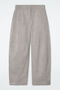 This season, the COS womenswear team take an understated approach to utility. Crafted from RWS wool, these modern pants are tailored in a relaxed shape with exaggerated barrel legs. The voluminous silhouette can be adjusted using the press-stud tabs at the waist and cuffs. Relaxed fitHook-and-bar and zip closureThis product contains Responsible Wool Standard TE-00047206 (RWS) wool fiber from farms certified to animal welfare and land-management requirements Shell: 100% RWS Wool. Pocket lining: 100% Cotton. Excluding trims / Dry clean Inside leg length of size 6 is 28.74" / Model wears a size 6 Modern Wide Leg Work Pants With Straight Hem, Modern Wide Leg Pants For Workwear, Modern Relaxed Fit Wide Leg Work Pants, Relaxed Fit Modern Pants For Office, Modern Business Casual Wide Leg Pants With Pockets, Modern Relaxed Fit Wide Leg Pants For Work, Modern Relaxed Fit Pants For Office, Modern Wide Leg Pants With Pockets For Business Casual, Modern Workwear Bottoms With Pockets