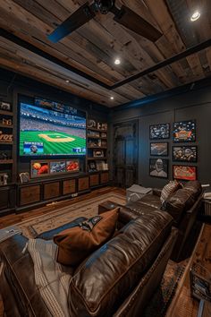 a living room filled with furniture and a flat screen tv mounted to the side of a wall