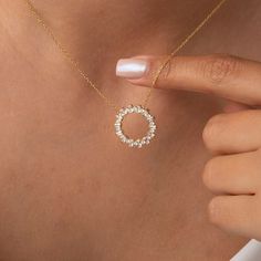 Adorn yourself with our exquisite 14k Gold and Diamond Circle Necklace. Available in a small size, this floating diamond circle pendant symbolizes the everlasting Circle of Life. Whether worn as a statement piece or for everyday elegance, this gold circle necklace radiates timeless beauty. Embrace the allure of this captivating accessory and order now. Alternatively, choose from our options of lab-grown diamonds or dazzling moissanites at three different price points to fit your unique preferenc Gold Diamond Circle Jewelry, Gold Circular Diamond Jewelry, Diamond Circle Halo Jewelry, Yellow Gold Full Circle Jewelry For Wedding, Yellow Gold Full Circle Wedding Jewelry, Gold Circular Diamond Necklace, Cubic Zirconia Open Circle Halo Jewelry, Gift Open Circle Necklace With Diamond Accents, Halo Cubic Zirconia Open Circle Jewelry