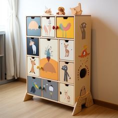 a wooden toy chest sitting on top of a hard wood floor next to a window