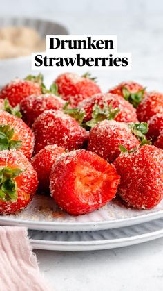 strawberries covered in powdered sugar on a white plate with the words easy drukken strawberries