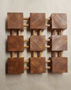 several pieces of wood sitting on top of each other in the shape of squares and rectangles