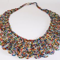 Artist Czech Glass Bead 19" Long Scalloped Style Necklace "Scalloped" Style Necklace Gorgeous: Multi-Color Brights Glass Beads 19" Long X 2 1/4" At Widest Section. Style Is Wider At Bottom & Narrows At Top One Of A Kind Necklace Handcrafted/No Two Are Exactly Alike Made In Guatemala Using Artisan Crafted Czech Glass Beads. Principles Of Fair Trade Are Upheld. Please Visit Our Posh Closet To See The Enchanted Collection: Necklaces,Bracelets & Earrings Multicolor Bib Necklaces With Dangling Round Beads, Multicolor Bib Necklace With Dangling Round Beads, Multicolor Bib Necklace With Round Dangling Beads, Bohemian Multicolor Jewelry With Bead Caps, Multicolor Beads With Bead Caps For Crafting, Festival Multicolor Beaded Necklaces With Bead Caps, Adjustable Multicolor Beaded Necklaces With Bead Caps, Multicolor Necklaces With Bead Caps For Party, Multicolor Beaded Necklaces With Bead Caps