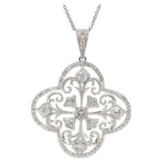 This pendant is made in 18k white gold, and it features round diamond set into a flower-style pendant. The diamonds have a total weight of 1.20cttw and they are graded G-H in color and VS-SI in clarity. The pendant measures 31mm in diameter, and it slides along an 18-inch 14k white gold chain. The necklace weighs 7.7 grams. Silver Diamond Necklace With Flower Design, Silver Diamond Necklace With Flower Accents, White Gold Diamond Necklace With Flower Shape Accents, Flower-shaped Diamond Necklace With Single Cut Diamonds, Flower Shaped Diamond Necklace With Single Cut Diamonds, Luxury Silver Diamond Necklace In Flower Shape, Luxury Silver Flower-shaped Diamond Necklace, Gardenia Flower, Diamond Flower Pendant