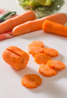 peeled carrots and lettuce on a cutting board