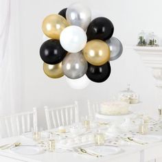 a bunch of balloons that are on top of a table