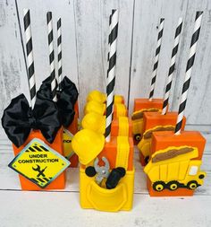 construction themed candles with black and white striped straws