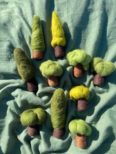 several different colored trees on a blue blanket