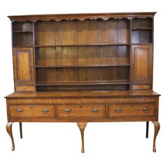 an old wooden bookcase with two drawers on one side and a drawer on the other