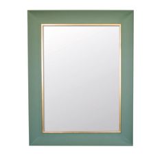 a green and gold framed mirror on a white wall with an empty space in the middle