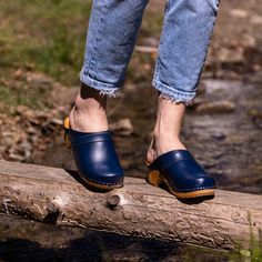 Introducing our Classic Women's Clogs in a versatile navy blue shade - a staple addition to any footwear collection. Designed with the utmost attention to comfort and durability, these clogs from TrendTree offer a modern spin on a timeless classic.  The rich navy blue color is versatile and stylish, perfect for various occasions and outfits. Whether you're going out for a casual stroll or heading to work, these clogs will ensure you step out in style while enjoying the ultimate comfort. One of t Excellent Health, Best Tan, Natural Contour, Women's Clogs, Footwear Collection, Unique Features, Clogs Shoes, Navy Blue Color, Womens Clogs