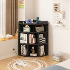 a room with a book shelf in the corner and pictures on the wall behind it