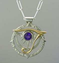 This egyptian pendant is made with sterling silver and 14 k solid gold ; this represent a unique  motif of eye of horus, a well-know egyptian symbol. It is very original, drawn and made by the artist. A perfect blend of past and present,  it is a one-of-a-kind jewel which will pass the test of time. A ideal present  for birthday(anniversary), Mother's Days, wedding, Christmas or to offer itself to oneself! pendant dimension : 2 cm you can choose between the amethyst stone or blue topaze, you can order also with a different stone if you like, don't hesitate to contact me! matching ring : https://www.etsy.com/ca/listing/512962240/women-ring-egyptian-ring-eye-of-horus?ref=shop_home_active_2 Because the environment means a lot to me just like you, all my jewelry is sent with the recyclable mat Eye Of Horus Pendant, Unique Sterling Silver Evil Eye Jewelry, Egyptian Jewelry Modern, Gringotts Vault, Egyptian Ring, Egyptian Inspired Jewelry, Egyptian Pendant, Egyptian Accessories, Egypt Jewelry