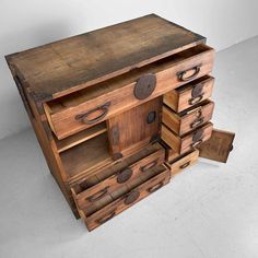 an old wooden dresser with lots of drawers