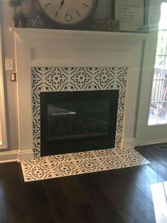 a fireplace with a clock on the mantle