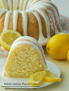 there is a lemon pound cake with icing on the plate next to some lemons